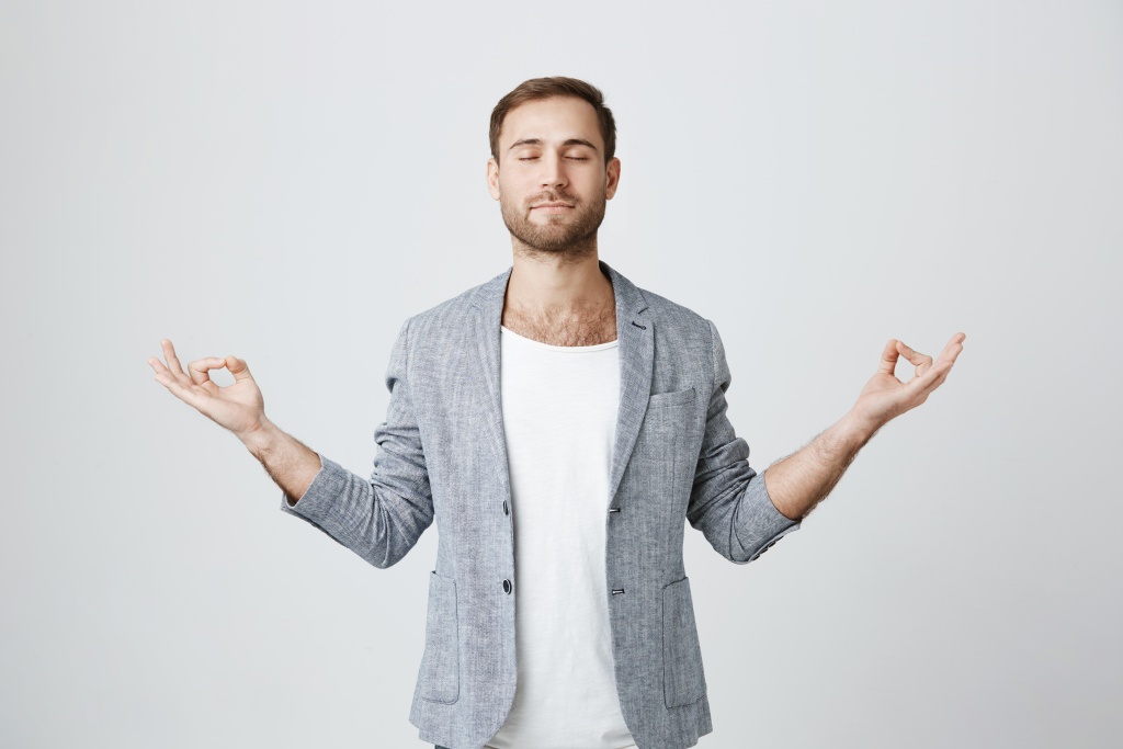 patient-calm-bearded-guy-meditating-with-closed-eyes.jpg
